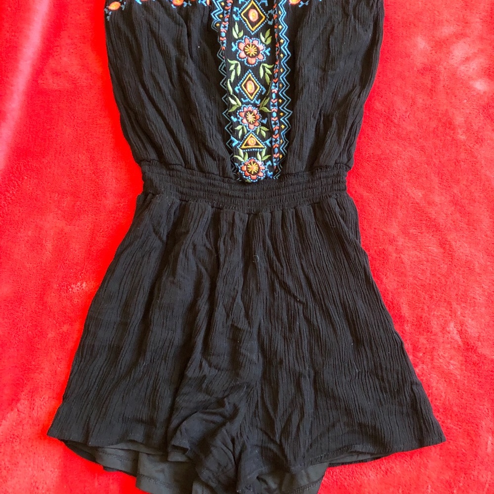 strapless black romper with minimal embroidery